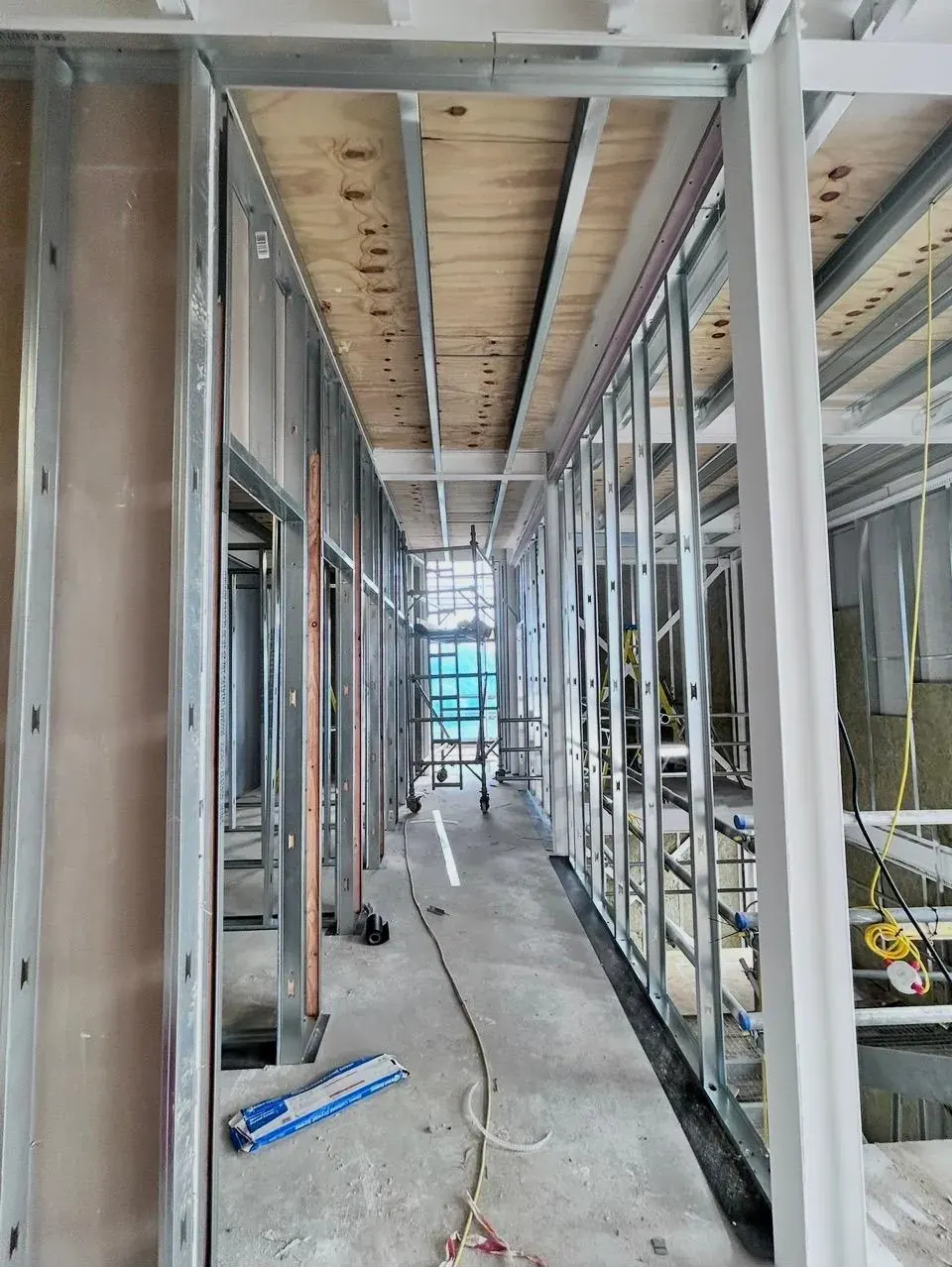 Boarded corridor partitions on a commercial job