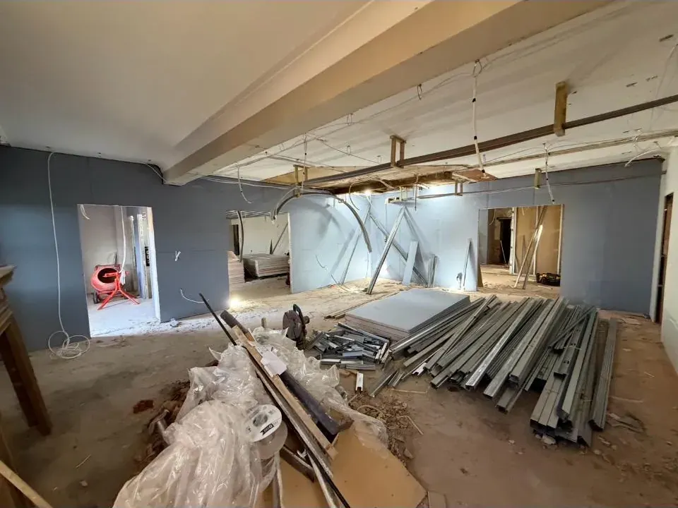 Open-plan commercial space prepared for a grid ceiling